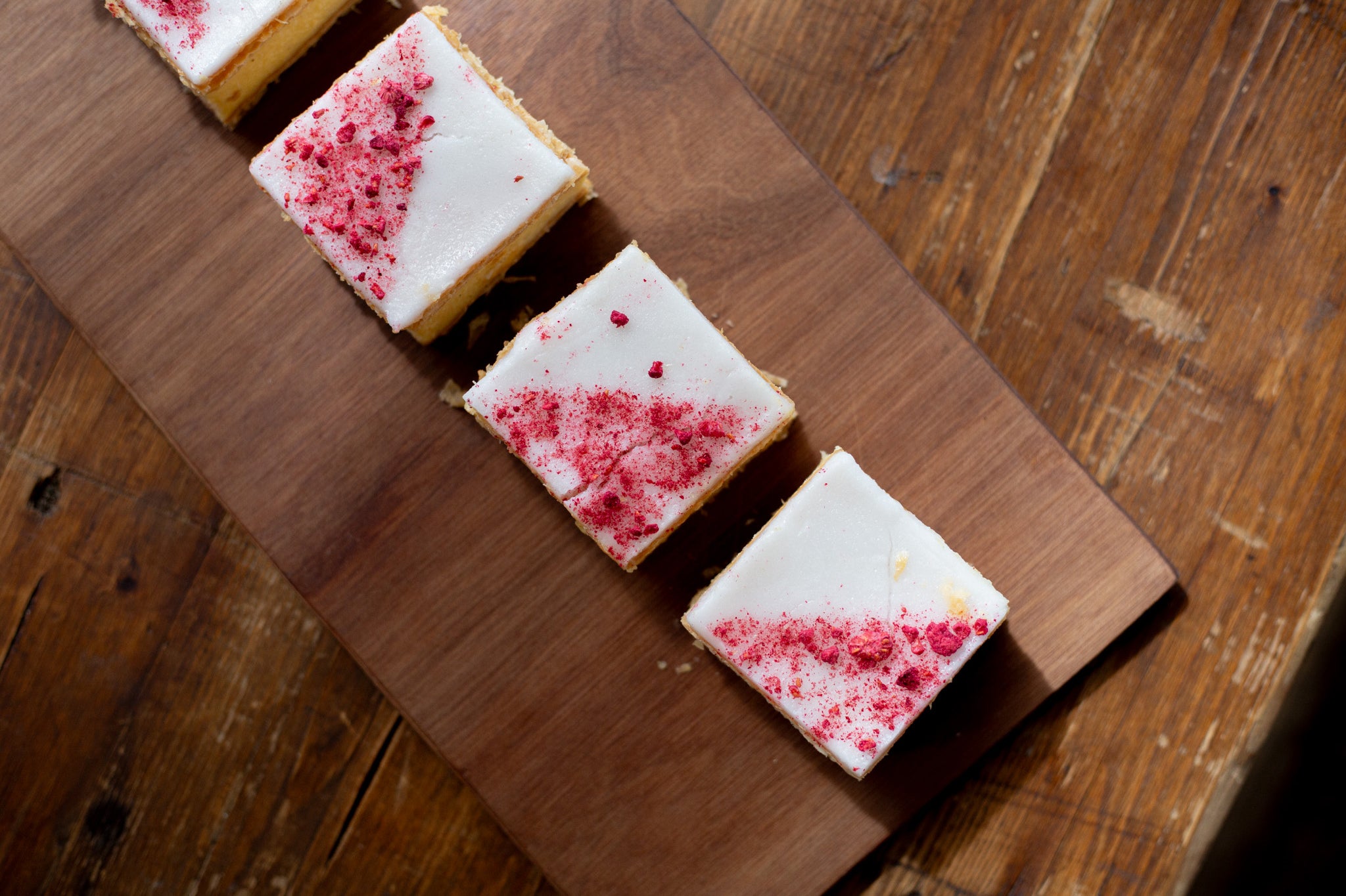 Top down view of four award-winning Volare custard squares