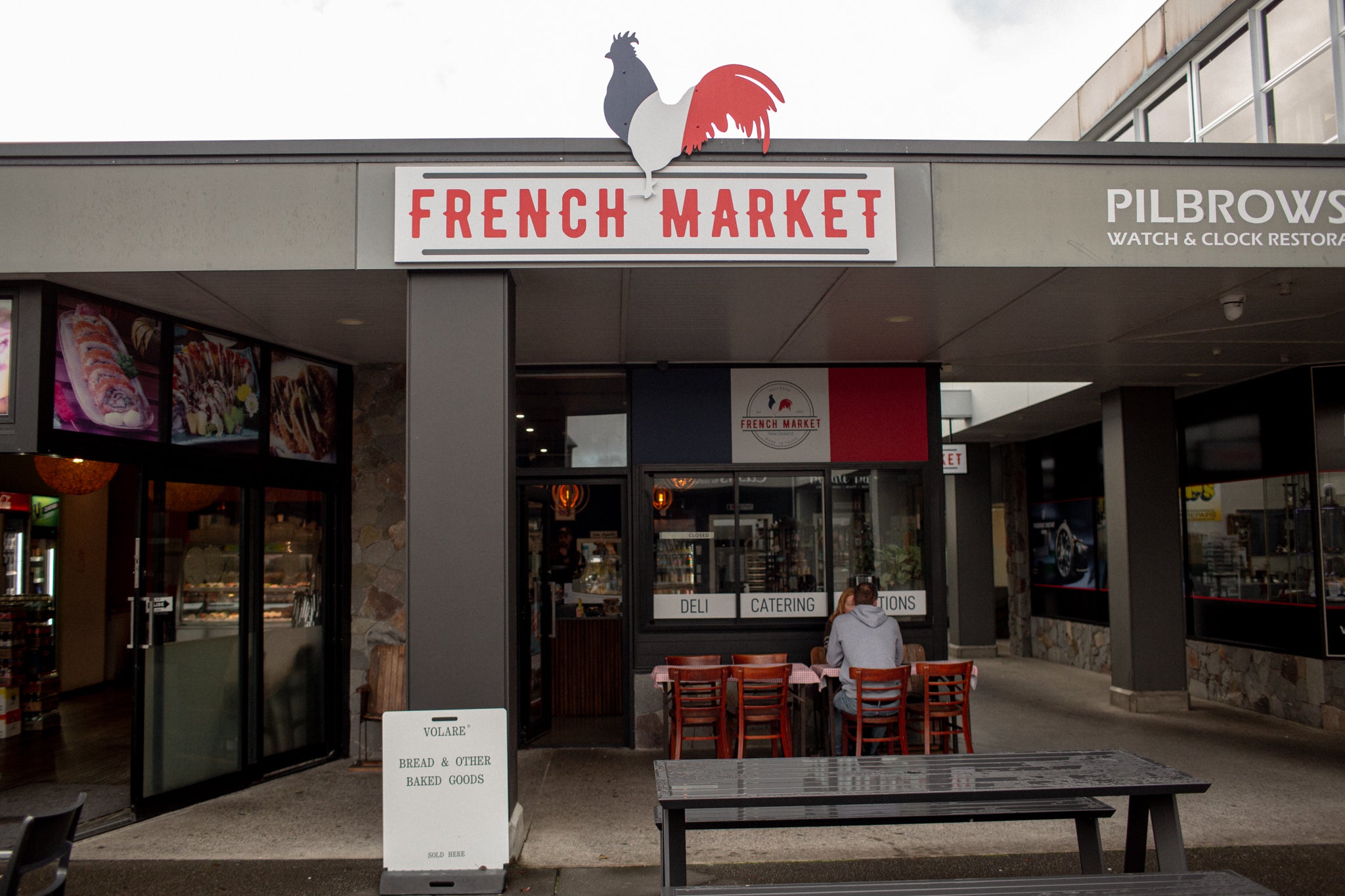 Exterior of Taupo French Market with Volare sign out front