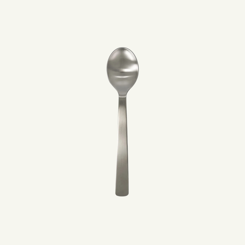 Acme stainless steel spoon on a white background