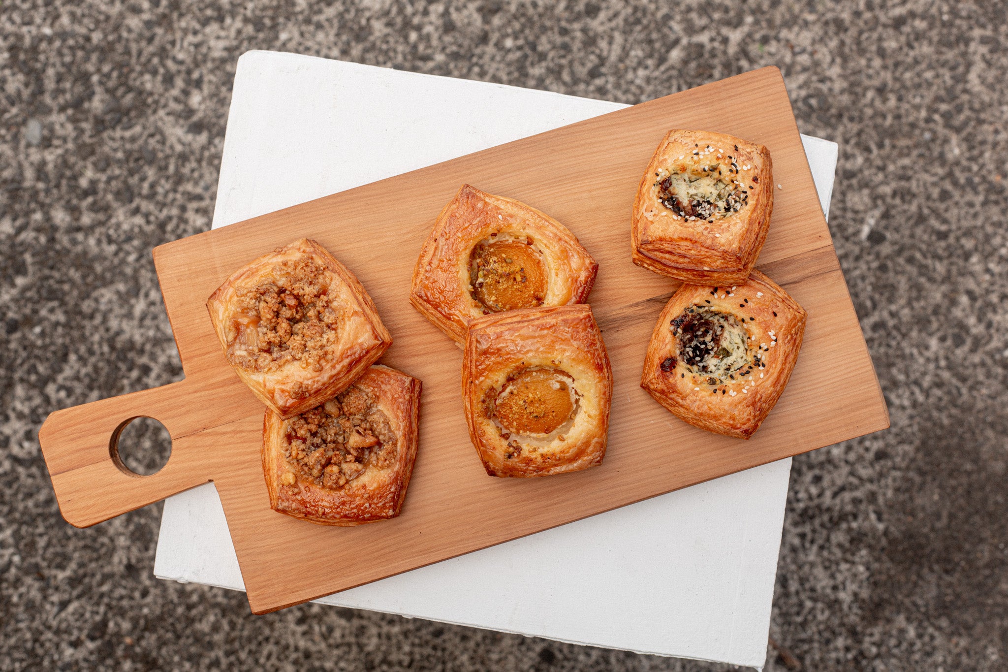 Volare Autumn Danish range lined up on a wooden chopping board