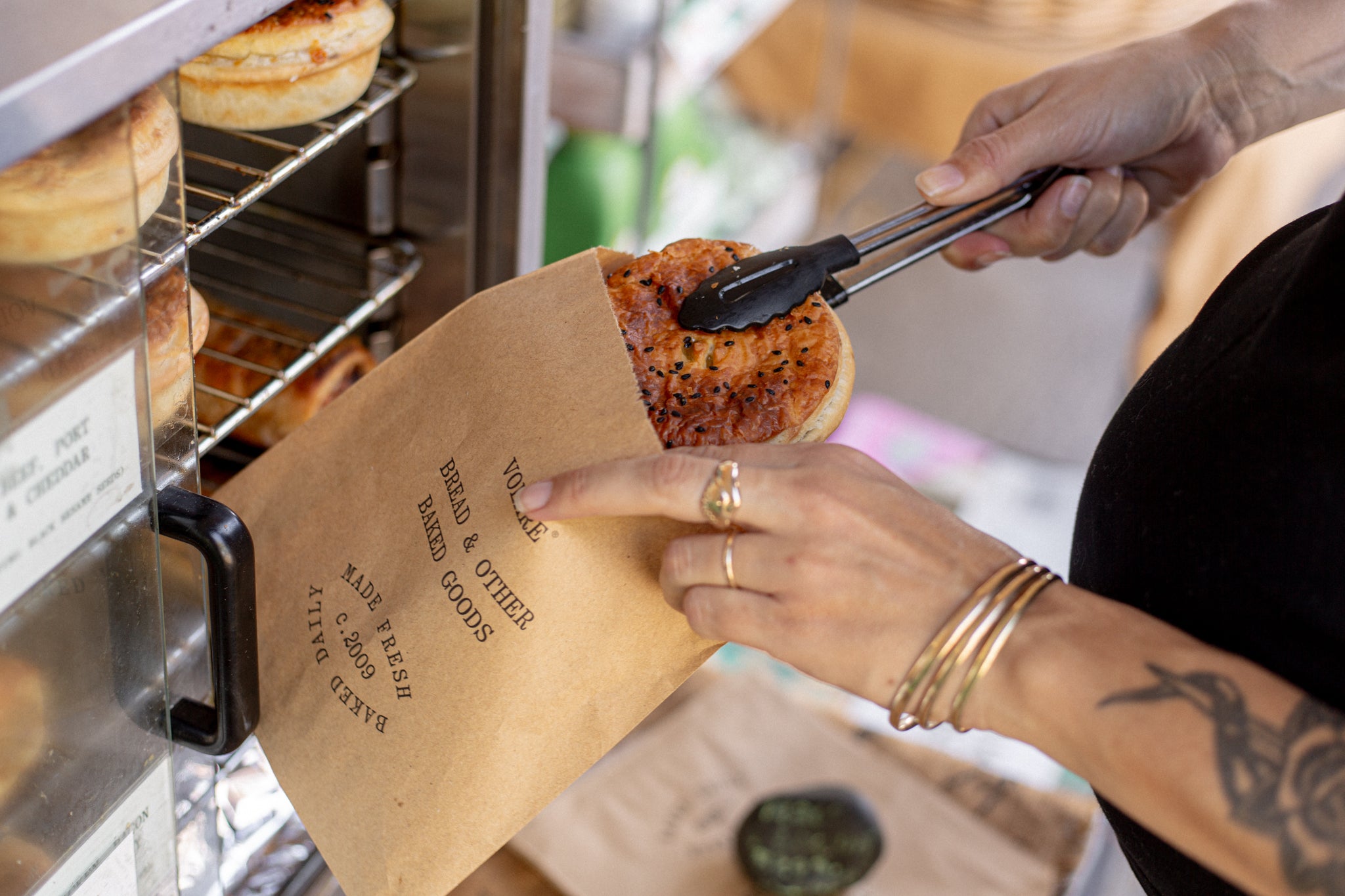 Volare Pie being removed from pie warmer outside Herbal Dispensary