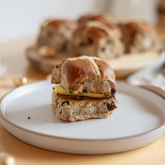 Volare Hot cross buns on a white plate with a blurred background