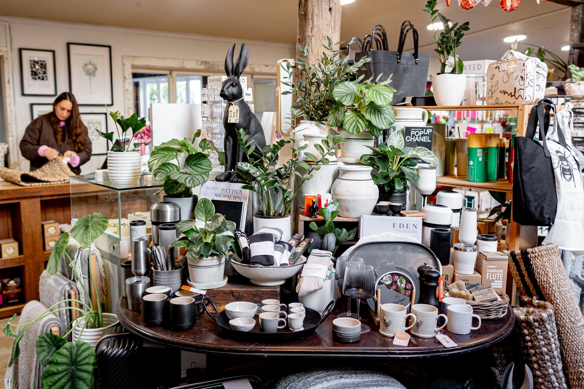 Curated table display of cups, plates, glasses, drink-ware with other dinnerware 
