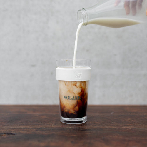 Milk pouring into coffee in Volare Cold Cup Keep Cup Collaboration 