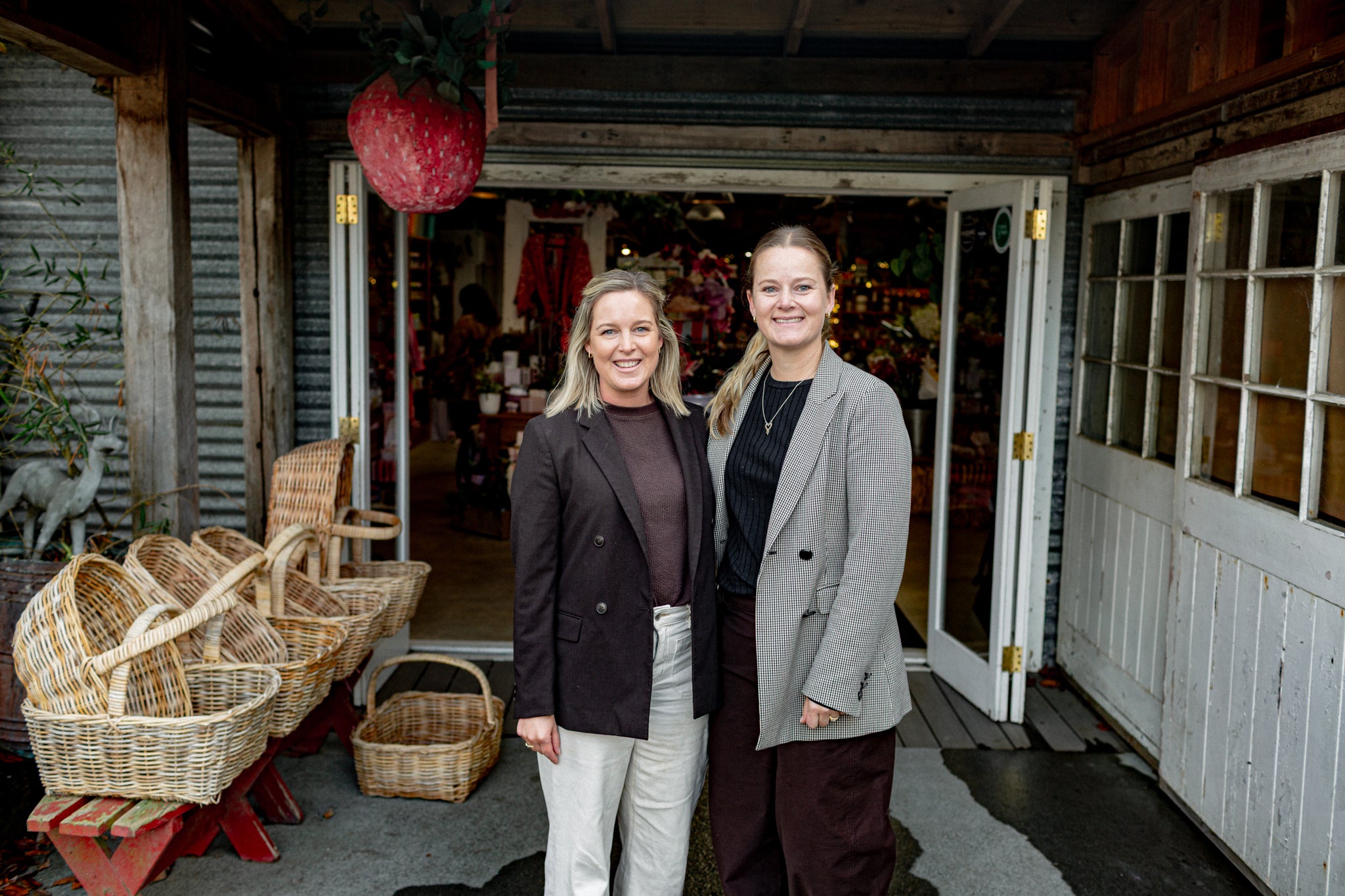 Emma and Kate owners of Country Providore in Tamahere standing outside store entrance.