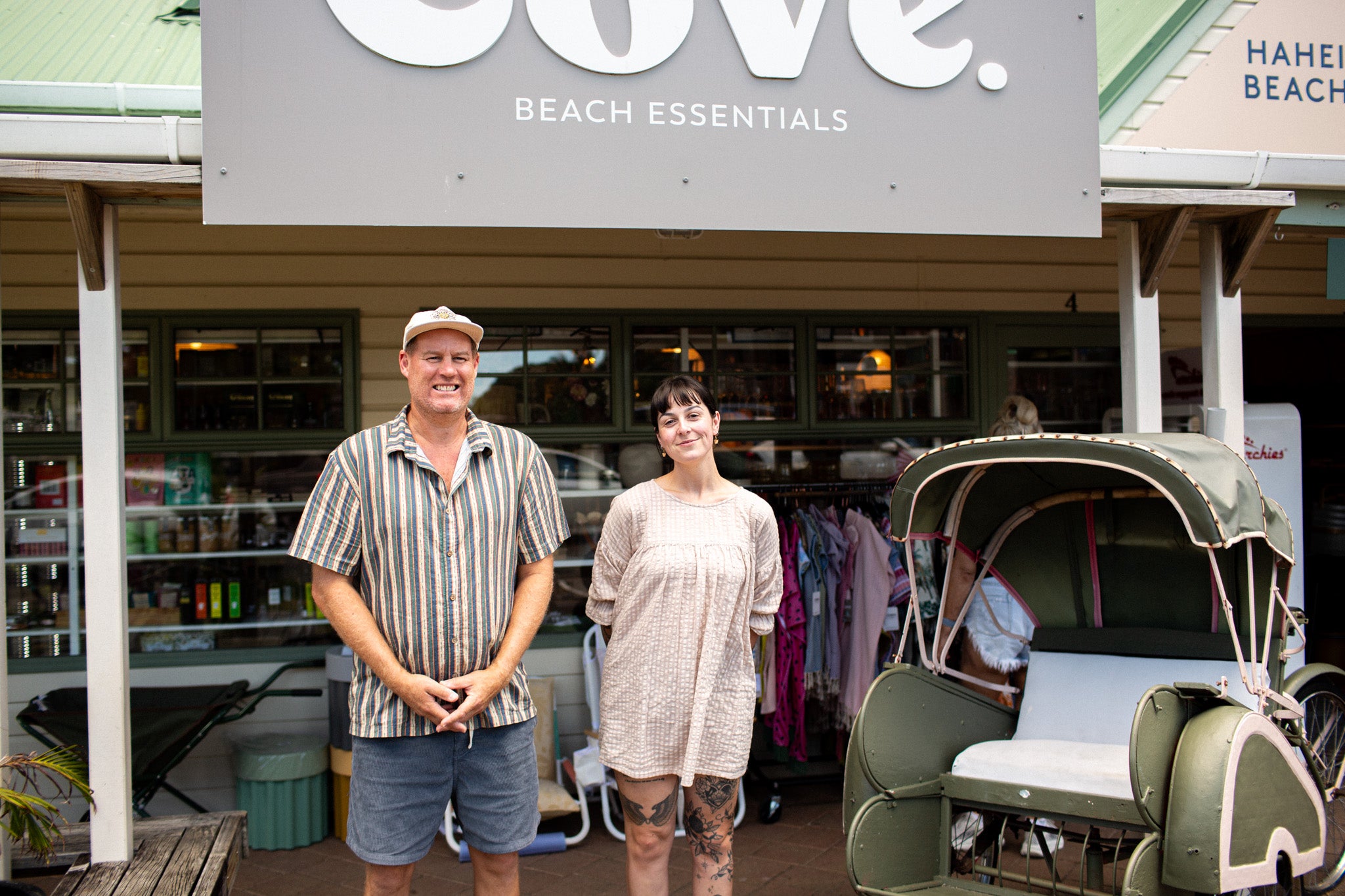 Owner Tim and Manager Chanel standing outside Cove Beach Essentials in Hahei