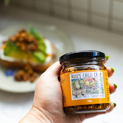 Hand holding a jar of 