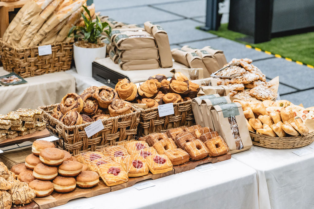 Table full of Volare freshly baked bread and pastries.
