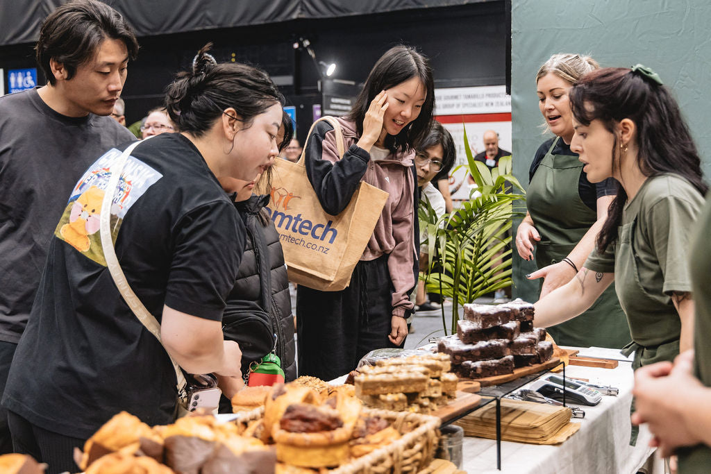 Ruby & Elise serving customers behind the Volare booth at the Auckland Food Expo 2026