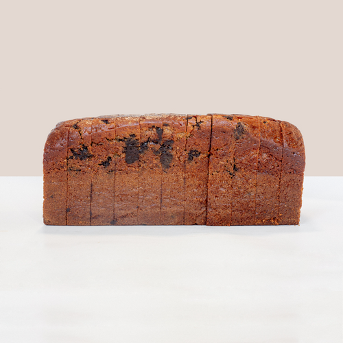 Loaf of pre-sliced Volare Chocolate Banana Bread with melted Callebaut chocolate chunks.