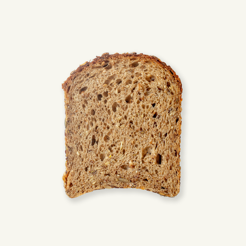 Cross section of Volare Grain Sourdough loaf showing seeds and crumb