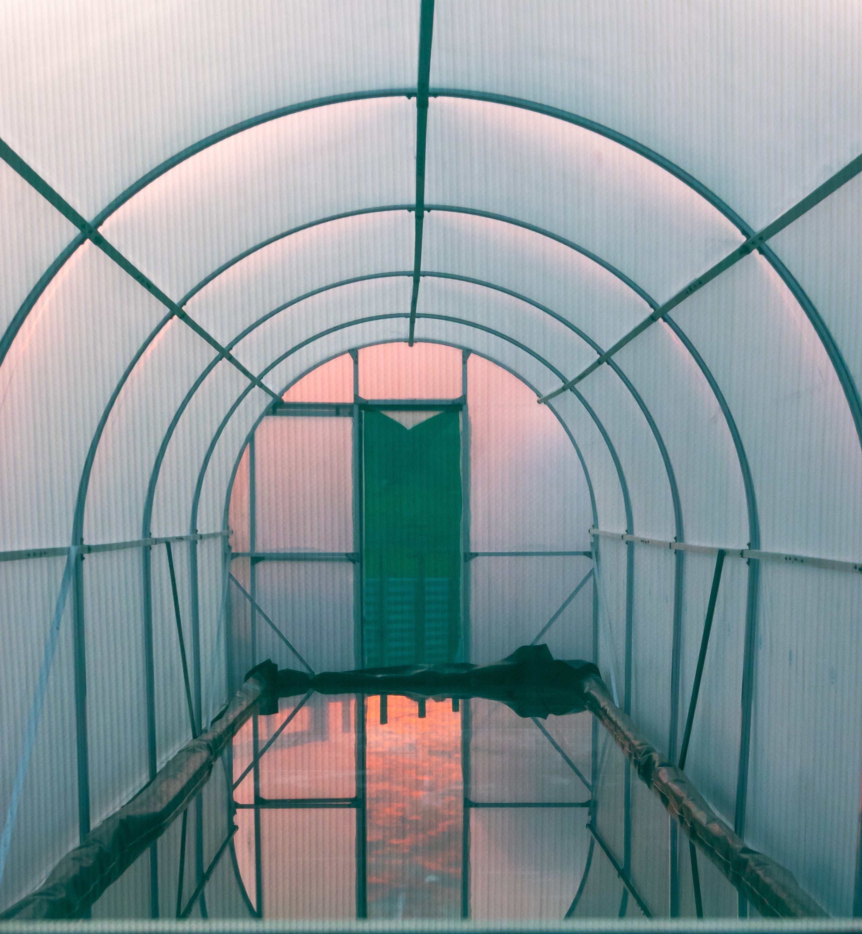 Opito Bay Salt farm interior of evaporation structure with curved roof and open door