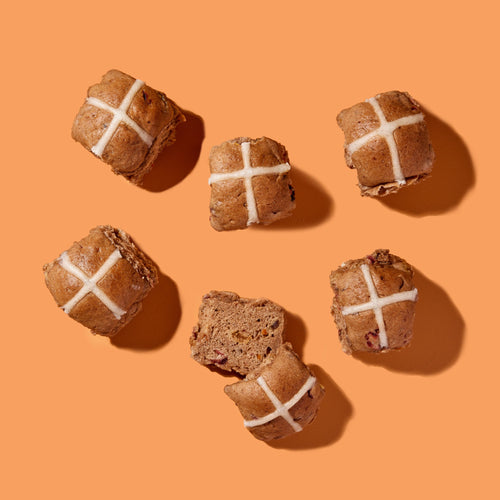 Hot cross buns with white crosses on an orange background