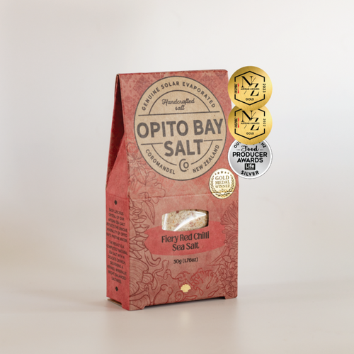 Opito Bay Fiery Chilli Sea Salt packaging with medals on a light gray background